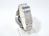 a watch that is sitting on a stand on a white surface