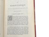 an open book with a picture of a man on it