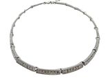 a close up of a necklace on a white background