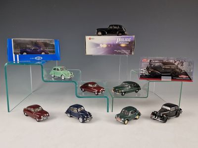 a lot of cars that are on display in a display case