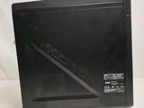 the back of a black desktop computer sitting on top of a white surface