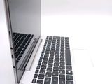 two laptops sitting side by side on a white surface