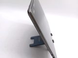 a close up of a cell phone on a stand