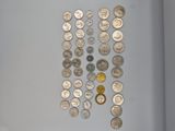 a lot of coins that are on the table