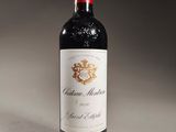 a bottle of wine that is sitting on a table
