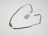 a gold chain with a tag attached to it