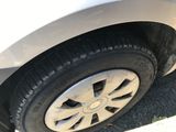 a close up of a car ' s tire on the street