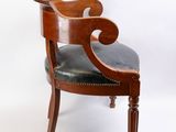 an image of a wooden chair with black leather upholstered seat