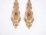 pair of gold tone earrings with blue and yellow flowers on them