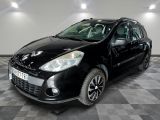 a picture of a small black car parked in a garage