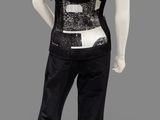 a woman ' s black and white top and pants on a mannequin mannequin mannequin mannequin mannequin mannequin manne