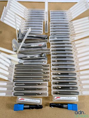 a lot of pens that are sitting on a table