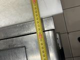 a measuring tape that is on top of a stove