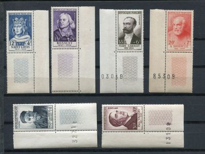 four different stamps with different faces on them on a black background