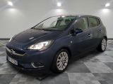 a blue opel parked in a room with a checkered floor