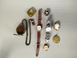 many different types of watches and other items on the table