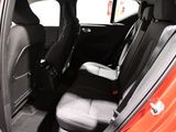 the interior of a small car with two rows of seats in it