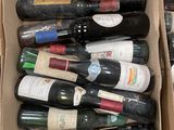 many bottles of wine in a box on the table