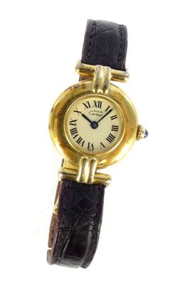 an image of a close up of a wrist watch with roman numerals