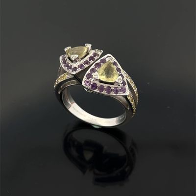 a close up of a ring on a black surface