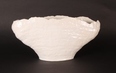 white bowl on black background with black background