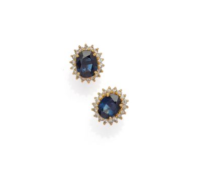 a pair of sapphire and diamond earrings