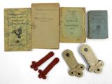 an old book with a bunch of different items sitting on top of it