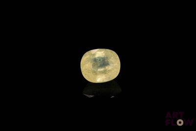 an image of a yellow moon in the dark sky with a reflection on the ground