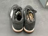 a pair of shoes that are sitting on the floor