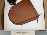 cardboard box containing a camera and a piece of paper on a table