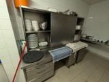 a kitchen with a lot of dishes and dishes on the counter