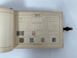 an open book with a bunch of stamps on it