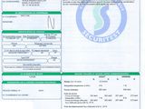 an image of a green and white document with a barcode on it
