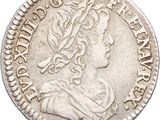 une pièce d'argent portant une tête de femme et une couronne