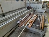a machine that is working on a piece of wood
