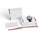 an image of a watch sitting on top of a box next to a card