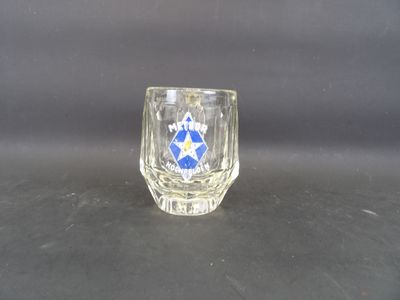 a shot of a shot glass with a blue star on it