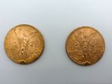 deux pièces d'or, dont l'une représente une femme et l'autre un homme