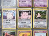 a lot of pokemon cards that are in a box