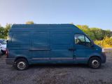a blue van parked in a parking lot