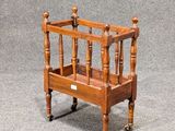 a small wooden bed that is sitting on the floor