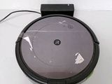 an image of a robotic vacuum cleaner on a white surface