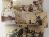 several old black and white photos of windmills and buildings