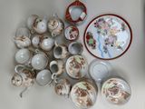 many different types of tea cups and saucers on the table