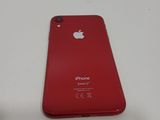 an apple iphone is sitting on a table with its back facing the camera