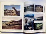 an open book with pictures of people and animals in it