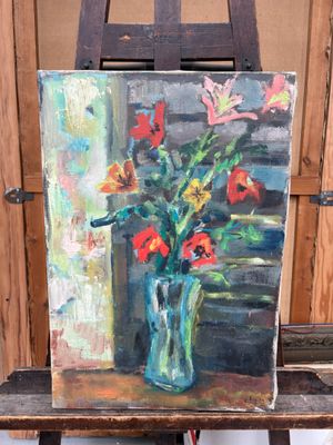 une peinture de fleurs dans un vase sur un chevalet