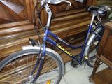 a bike that is parked in front of a piano