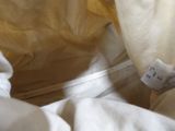 a close up of a white pillow with a label on it