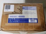 a cardboard box with a sticker on it sitting on a table